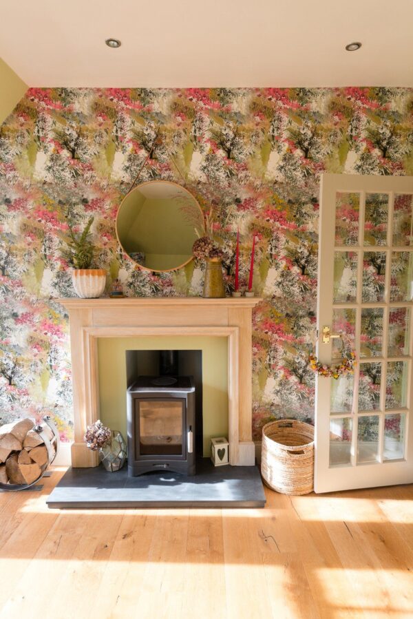 Room Setting: "Living room styled with Summer Isle wallpaper, creating a peaceful, nature-inspired atmosphere with floral and grass designs."