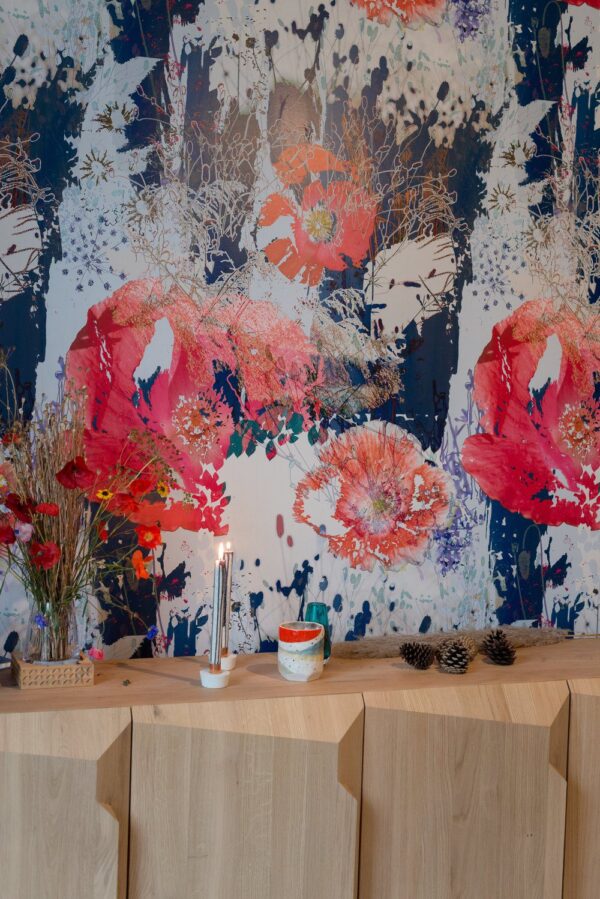 Room Setting: "Living room styled with Poppy Cloud wallpaper, creating a calm, inviting atmosphere with light furnishings."