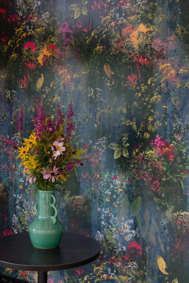Main Image: "Rainfall Blooms wallpaper by Mairi Helena featuring flowing floral patterns in green, blue, and yellow tones."